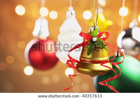 Group of colorful Christmas ornament with blurred light on warm background