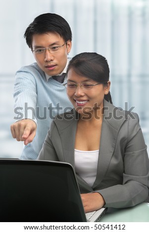 Asian business people working together in office