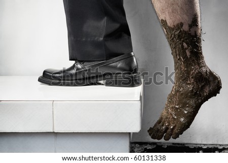 Success concept from poor to be rich, one leg step from below with full of mud and the other leg using business attire. Legs of one person, without composit