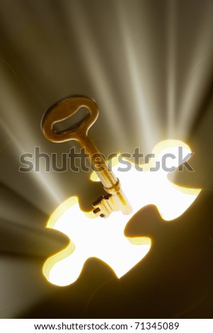 Concept photo using piece of puzzle with ray of light comes out from missing piece
