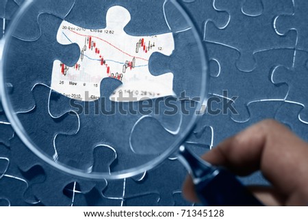 Jigzaw puzzle and economic graph under it, showed on mssing piece