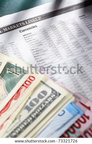 Foreign exchange sheep paper with money from different countries on edge