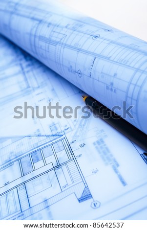 Architecture blueprint paperwork on table with drawing instruments