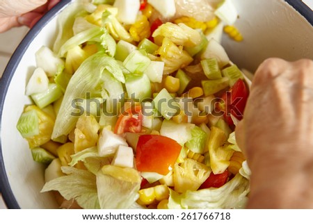 Mixing all the salad ingredients