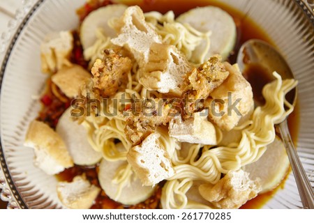 Lontong mie in Indonesian for its famous traditional food, or in English maybe spelled rice cake and noodle in vegetable soup