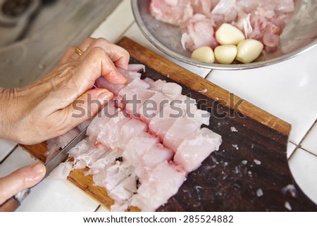 Cutting the fish to make fish ball