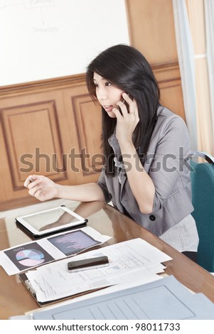Chinese businesswoman is talking on the phone