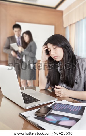 Chinese businesswoman looks depressed working in the office