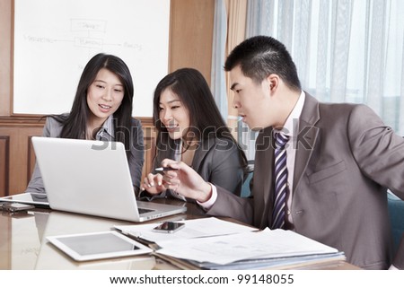 Group of Chinese business people working together in the office