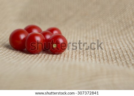 Grape tomatoes on burlap