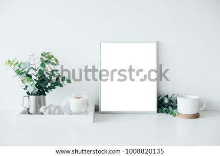 Natural eco home decor with green leaves, poster mock-up and bur