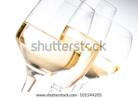 Three different glasses of white wine, close-up