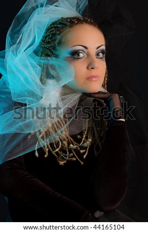 Girl with stage makeup in theatrical costume