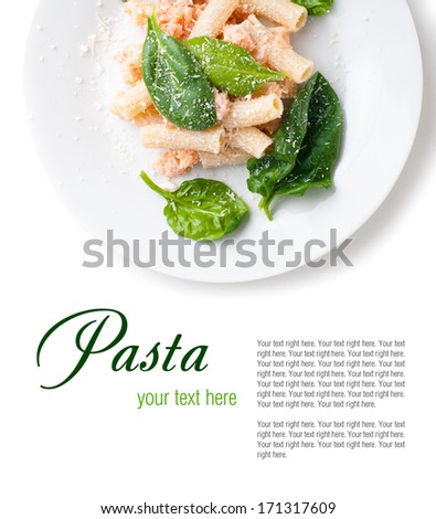 Pasta with salmon and spinach, portion of rigatoni with seafood and parmesan cheese, Italian food, isolated on white background