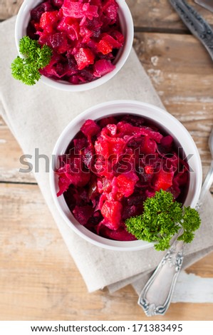 Vegetarian beetroot salad with parsley, useful natural food with vegetables and greens, rural cuisine