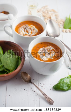 Living healthy food: pumpkin soup with cream and herbs. Vegetarian lunch, rustic dinner.