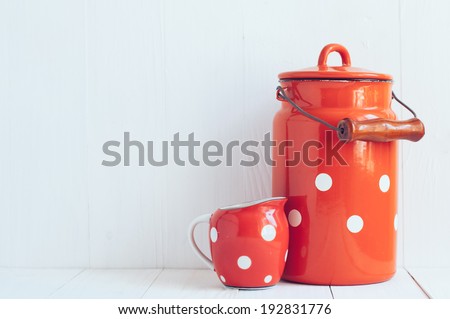 Set of vintage utensils, milk can and small polka dots milkman, home kitchen decor in country style, painted white background
