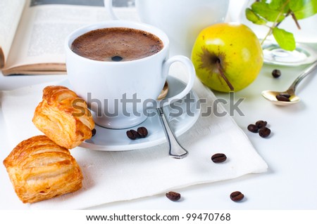 Fresh appetizing breakfast, coffee, pastries and fruits on a white background