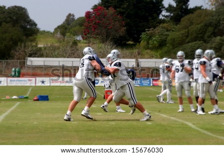 The Dallas Cowboys at their 2008 summer training camp in Oxnard, CA during a training session working out.