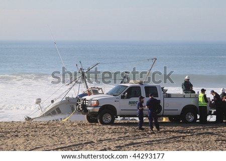 VENTURA, CA - JANUARY 8 : Fishing boat SAI GON I runs aground after 4 people were rescued early morning January 8, 2010 in Ventura, CA. Rescue team tried to free the boat throughout the day.