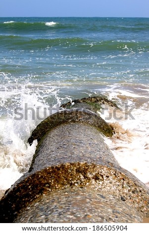 Sewage pipe having their outlet right into the ocean pollutiong the water.