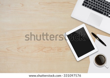 Office workplace with text space ,Wooden table with office supplies smartphone,laptop,tablet and coffee cup, top view