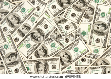 stock-photo-heap-of-dollars-money-background-69095458.jpg