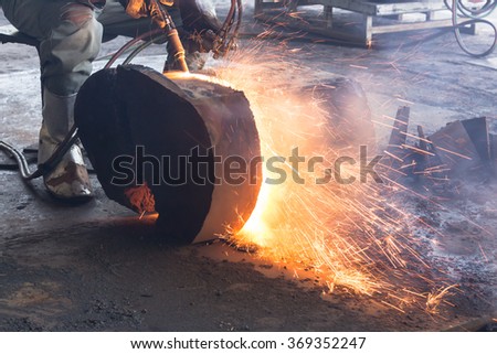 Worker are cutting steel, Background of Industry steel, Sparkles and light gas cutting.