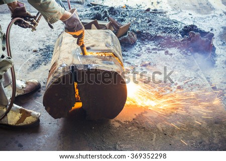 Worker are cutting steel, Background of Industry steel, Sparkles and light gas cutting.