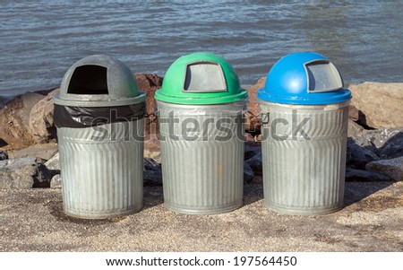 Three public trash cans for different kind of garbage beside riverside, Manhattan Bridge