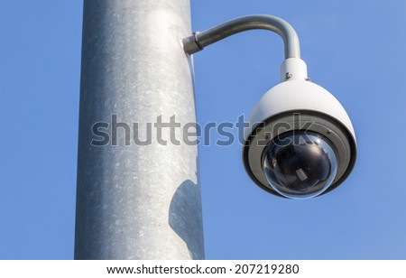 Security camera, CCTV on blue sky background for close monitoring