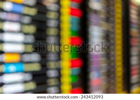 High key blurred image of Departure and arrivals electronic schedule board in airport.