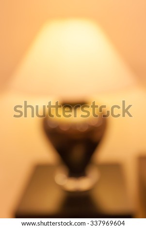 Blurred abstract background of table lamp decorated in the hotel lobby.