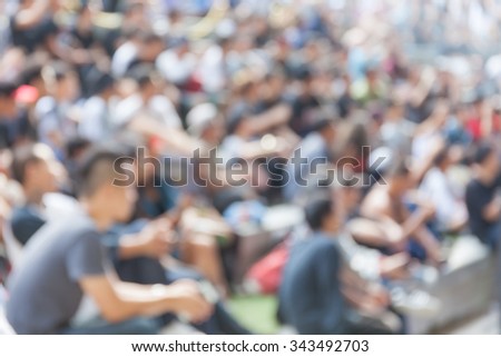 Abstract blurred background of young teenager watching b-boy street dance.
