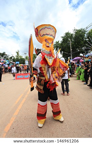 LOEI PROVINCE,THAILAND-JUNE 11:Unidentified men wear ghost costumes at Ghost Festival (Phi Ta Khon - a masked procession celebrated by Buddhist) at Dan Sai district in Loei Province on June 11, 2013.