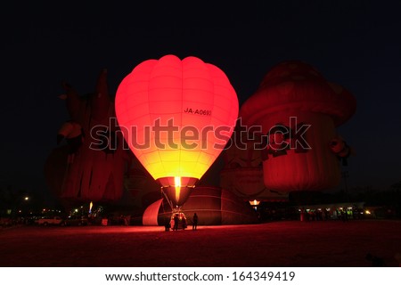 CHIANGMAI, THAILAND-NOVEMBER 23 : People come to watch the release of balloons in the night at Thailand International Balloon Festival in Chiang Mai on November 23, 2012 in Chiangmai,Thailand