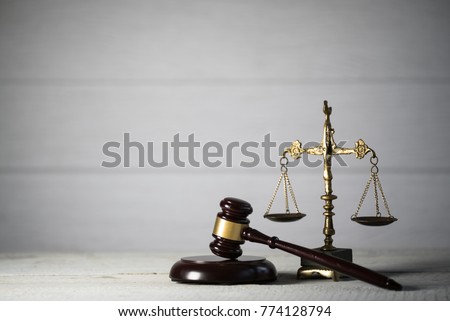 Law and Justice concept. Mallet of the judge,  Gray background, place for typography. Courtroom theme.