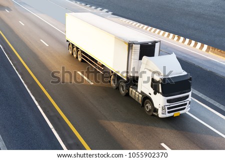 White Truck on highway road with container, transportation concept.,import,export logistic industrial Transporting Land transport on the expressway.motion blurred to soft focus