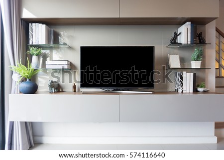 Led TV on TV stand in empty room with white wall. decorate in modern style.