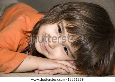 European four-year-old brown-eyed smiling girl Victoria (series Children)