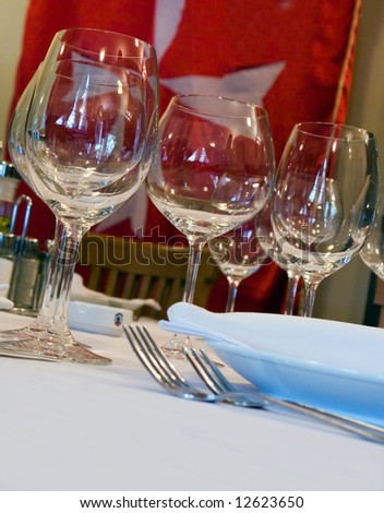 Table appointments for dinner in restaurant (series Holiday, Symbol and Glass)
