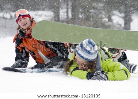 A lifestyle image of two young adult  snowboarders (series Sport, Extreme, Mountains, Teenagers)