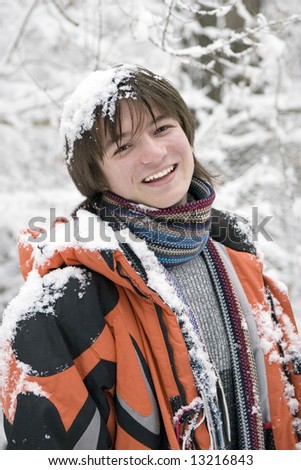 European teens boy in scarf are laughing outdoors in winter (series Sport, Extreme, Mountains, Horses and Teenagers)