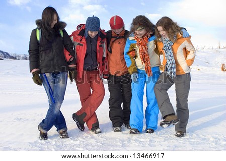 Group of sports teenagers in mountains, over blue sky (series Sport, Extreme, Mountains, Horses and Teenagers)