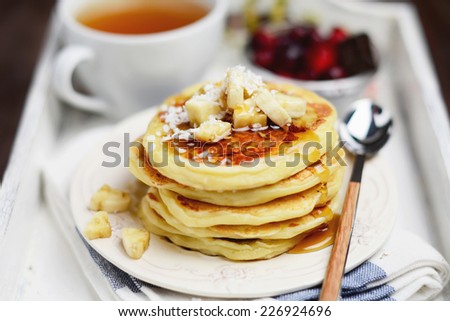 Breakfast batch of pancakes with banana and coconut