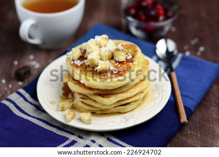 Breakfast batch of pancakes with banana and coconut