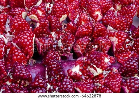 Ripe red grains of  pomegranate for texture and  background