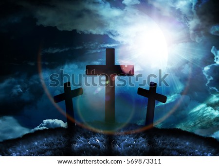 Silhouette of three crosses on a hill