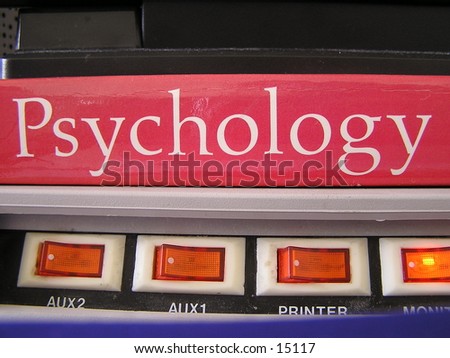 This is a Psychology book on top of a Power Strip