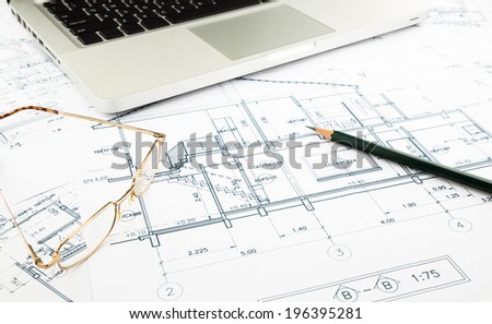house blueprints and floor plan with keyboard, architecture business concepts and ideas